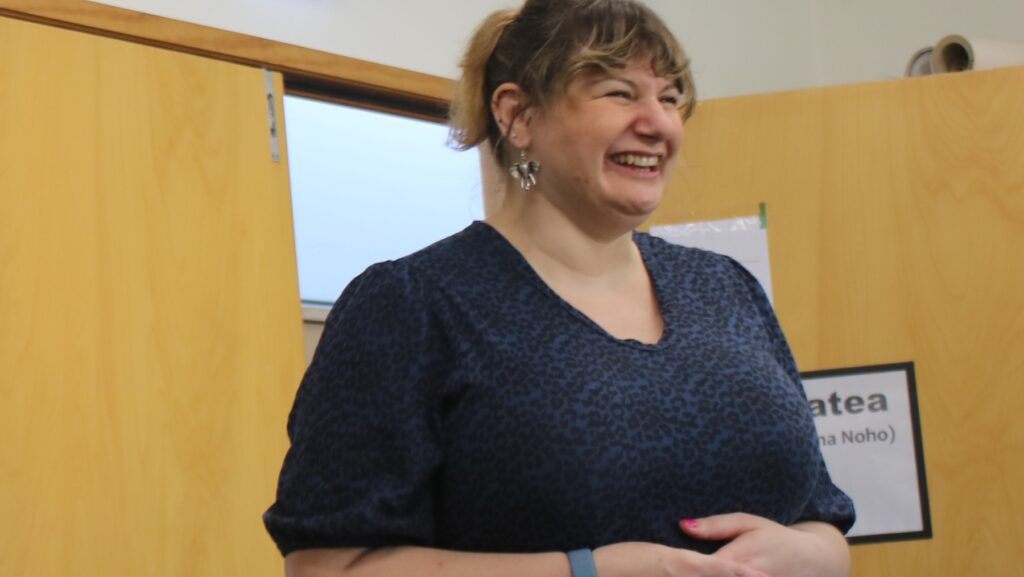 a woman smiling in a room