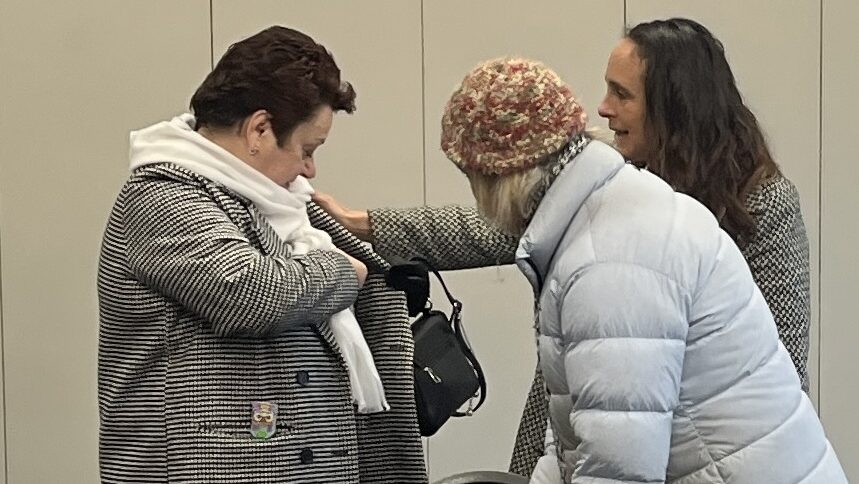 Three women chat prior to the start of talk business networking