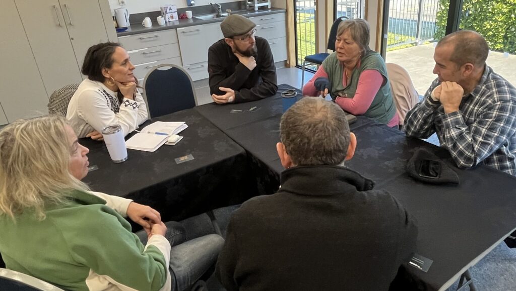 a group of people sitting around a table