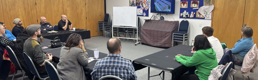 Group of networkers watching a business idea on video