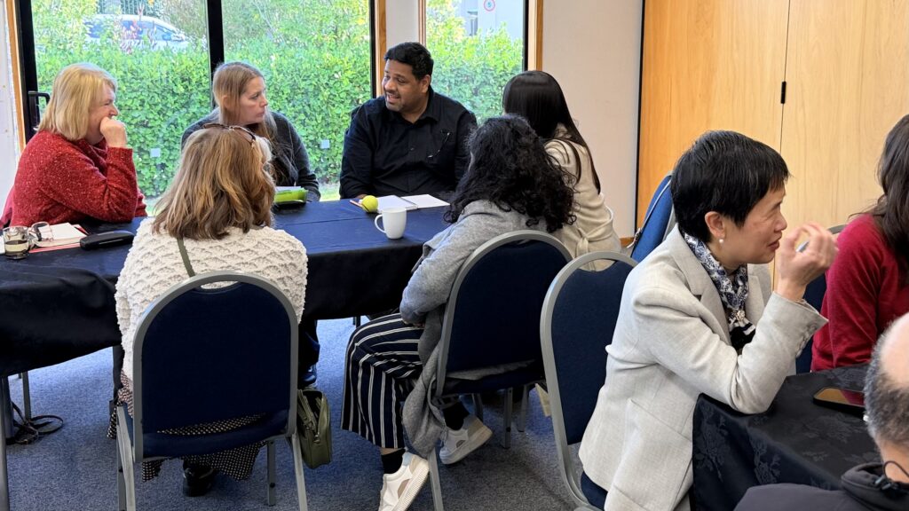 Group of people discussing things at Talk Business