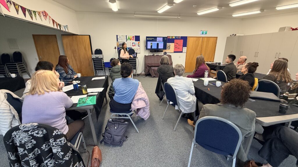 Title Alt Text A guest presenter speaking to attendees at a Talk Business networking meeting in Christchurch, New Zealand.